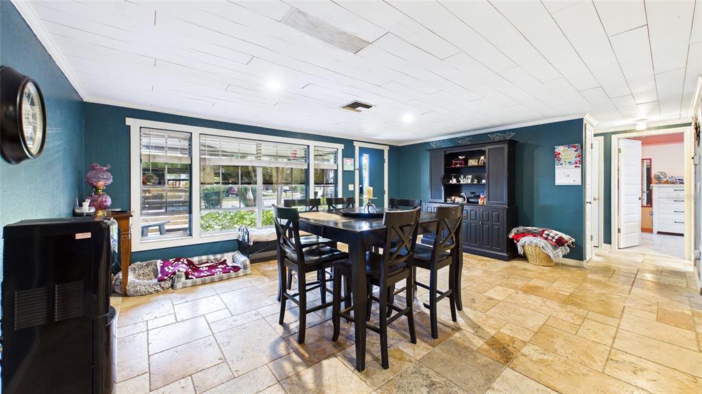 3849 Edgemont Drive New Port Richey, FL 34652 - Photo 16 of 43 a view of a dining room with furniture window and outside view
