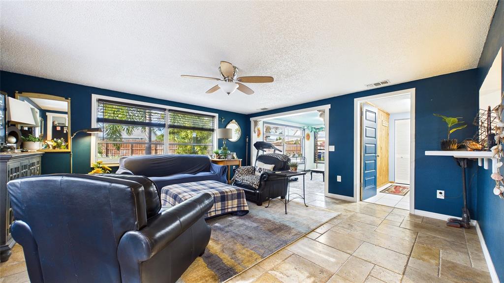 3849 Edgemont Drive New Port Richey, FL 34652 - Photo 22 of 43 a living room with furniture ceiling fan and a window