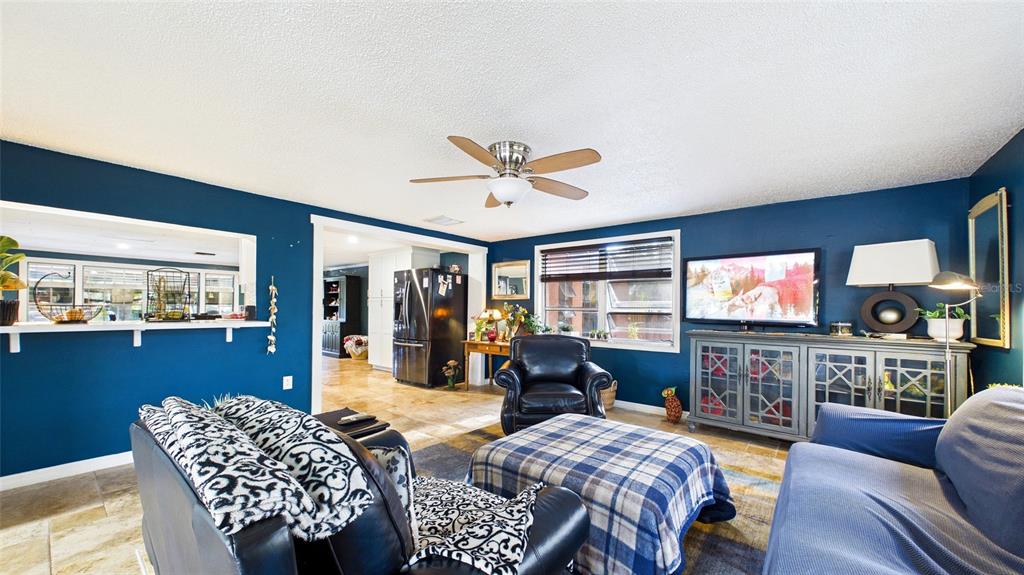 3849 Edgemont Drive New Port Richey, FL 34652 - Photo 23 of 43 a living room with furniture and a flat screen tv