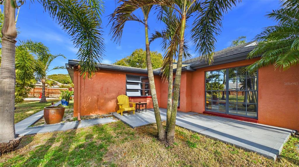 3849 Edgemont Drive New Port Richey, FL 34652 - Photo 42 of 43 a backyard of a house with seating space