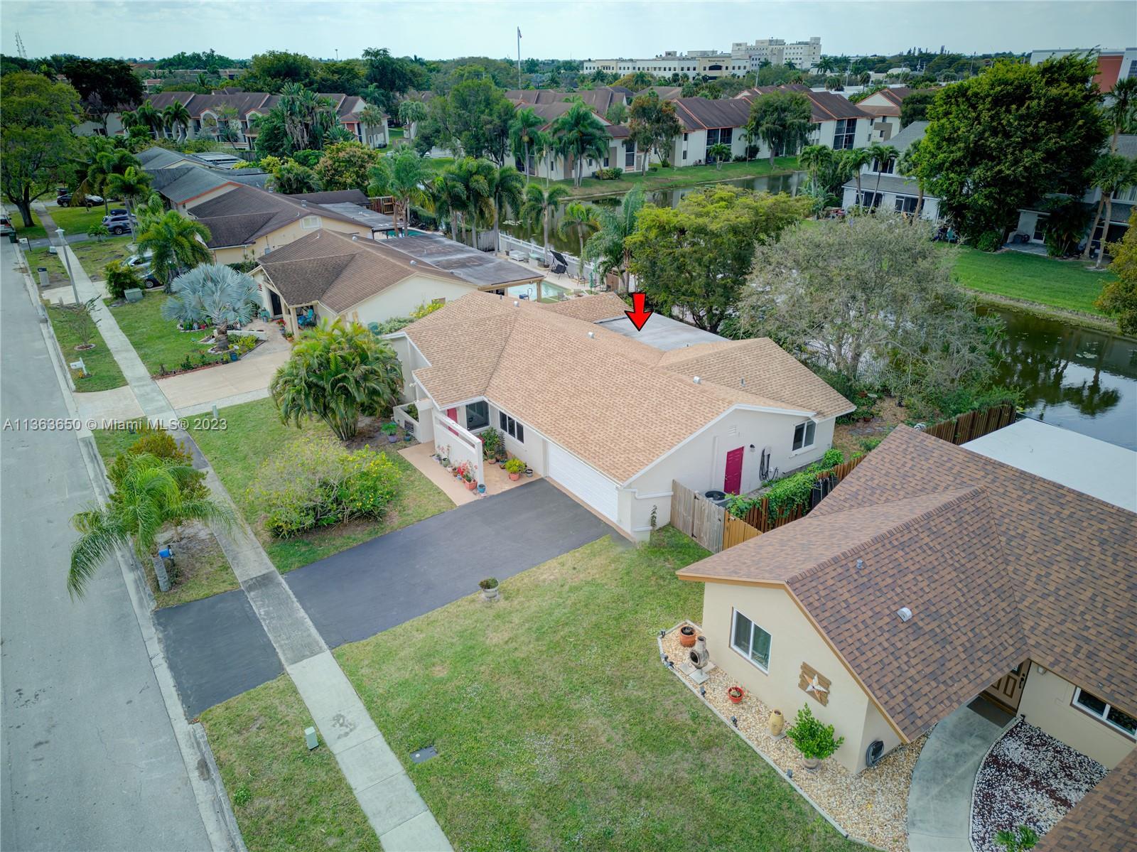 Coral Gate Margate, FL 33063 - Photo 12 of 16 an aerial view of a house with yard