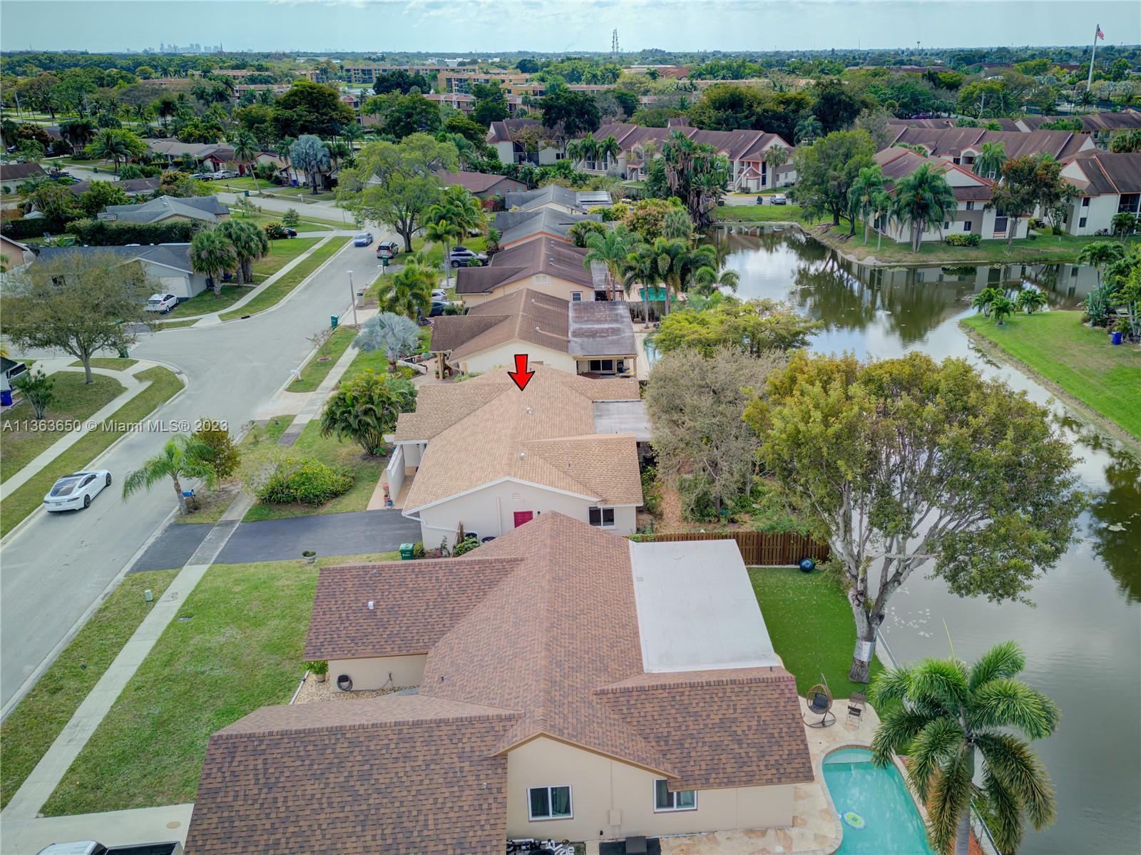 Coral Gate Margate, FL 33063 - Photo 13 of 16 an aerial view of residential houses with outdoor space and lake view