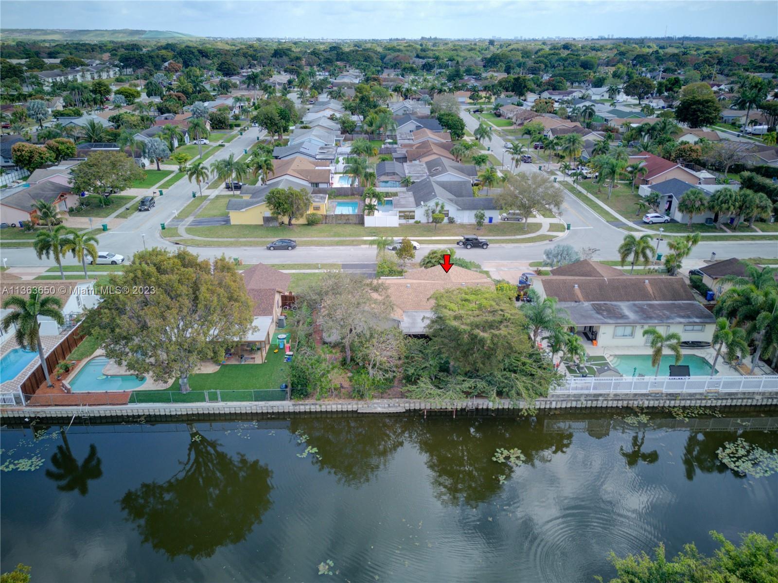 Coral Gate Margate, FL 33063 - Photo 14 of 16 an aerial view of residential houses with outdoor space and lake view