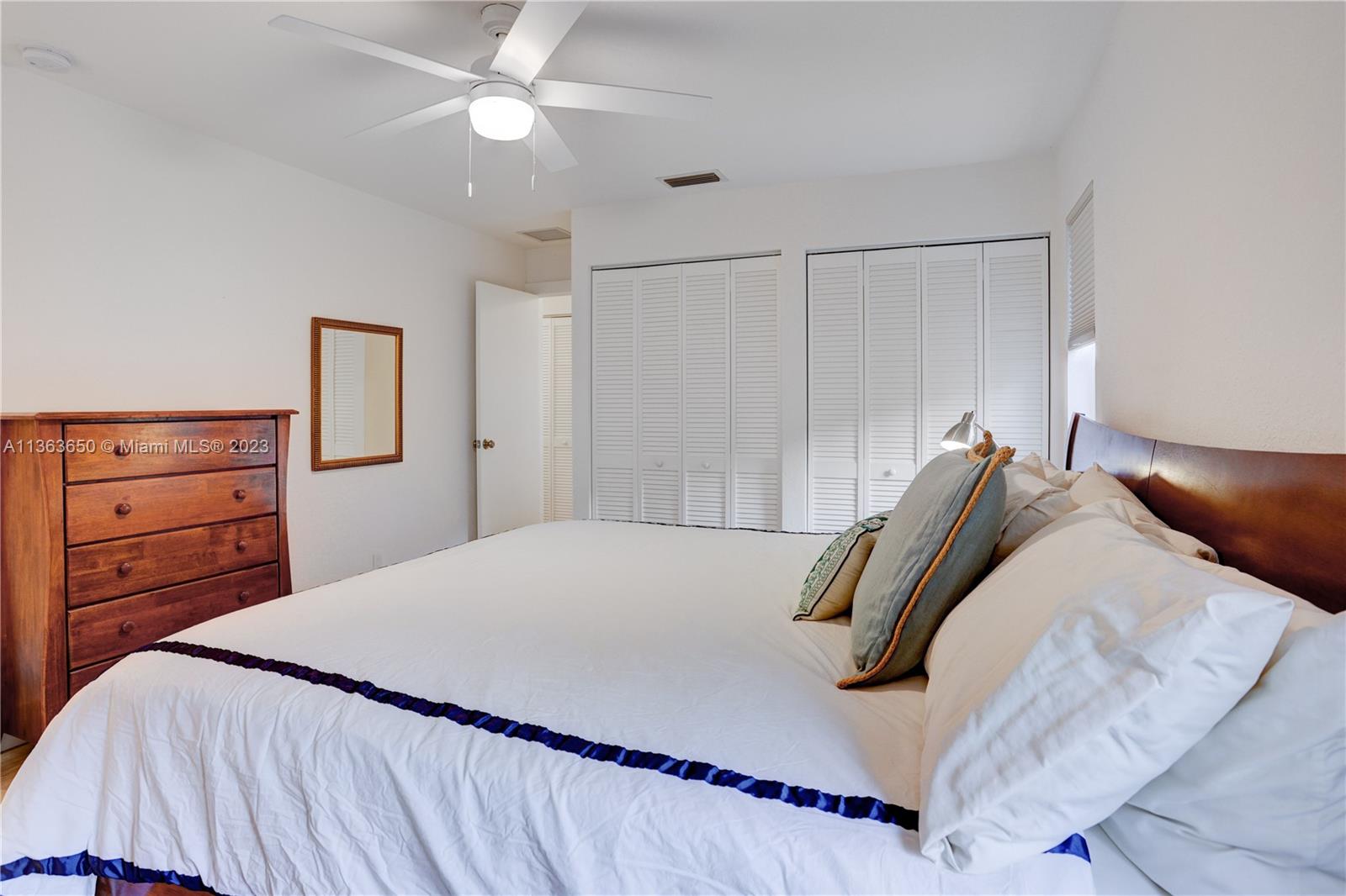 Coral Gate Margate, FL 33063 - Photo 5 of 16 a bedroom with a bed and closet