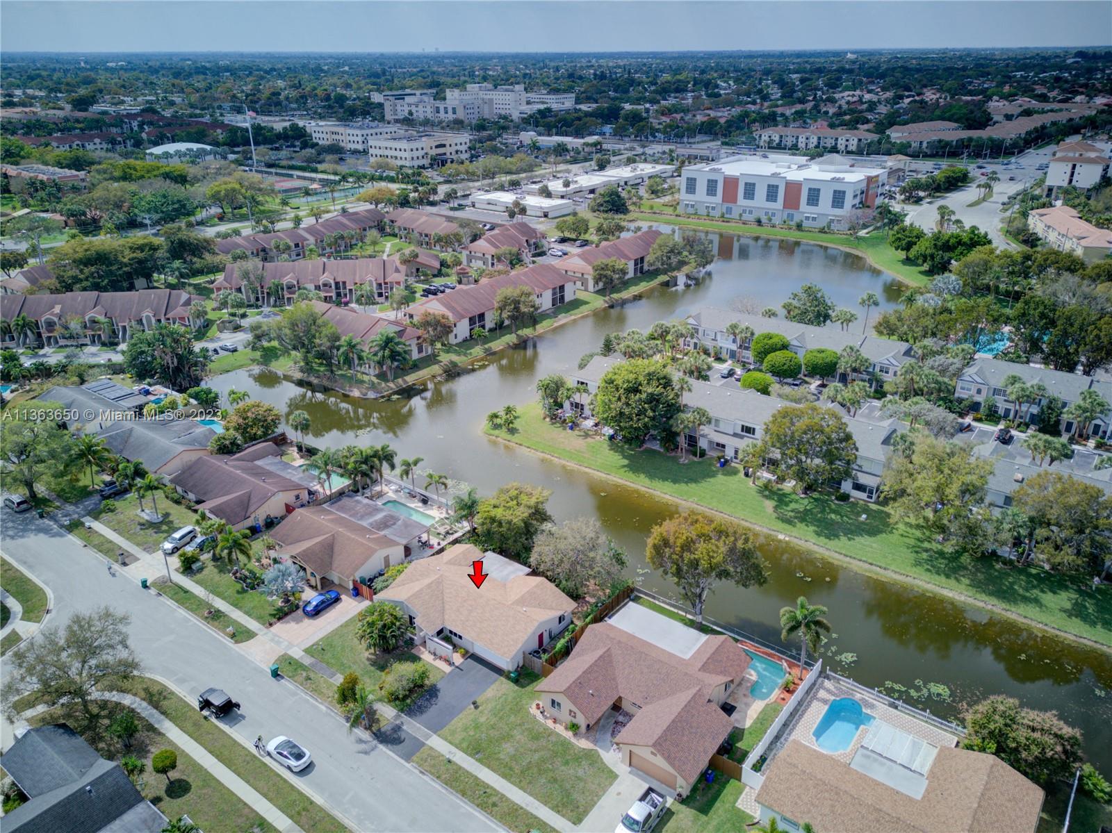 Coral Gate Margate, FL 33063 - Photo 8 of 16 an aerial view of a house with a lake view