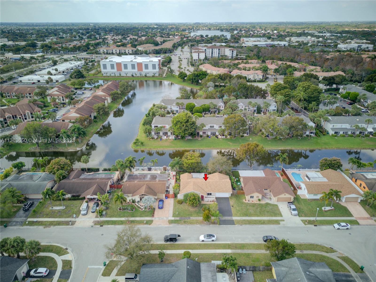 Coral Gate Margate, FL 33063 - Photo 10 of 16 an aerial view of residential houses with outdoor space and lake view