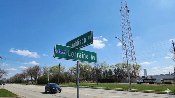 a view of street with parked cars