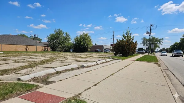 a swimming pool with outdoor seating and yard