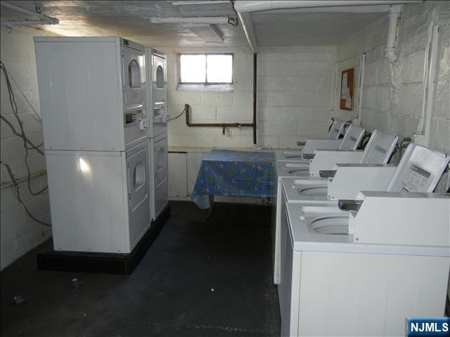 401 West Madison Avenue, Unit 7 Dumont, NJ 07628 - Photo 10 of 10 a living room with furniture and a fireplace