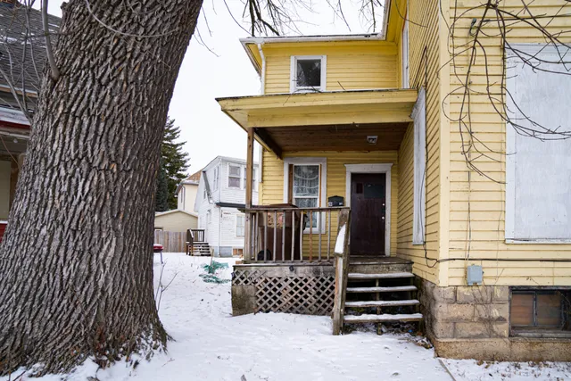 a view of a house with wooden walls