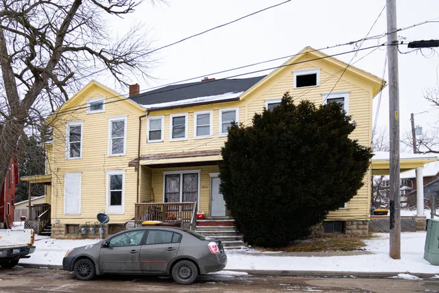a car parked in front of a house