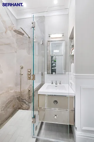 a kitchen with a sink appliances and cabinets