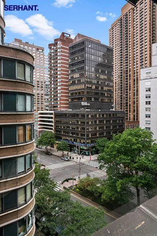 a view of bedroom with furniture and windows