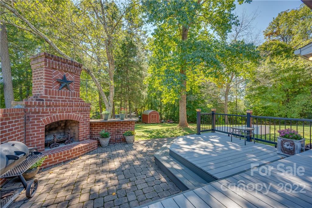 106 Gray Court Rutherfordton, NC 28139 - Photo 3 of 46 a backyard of a house with fireplace table and sofas