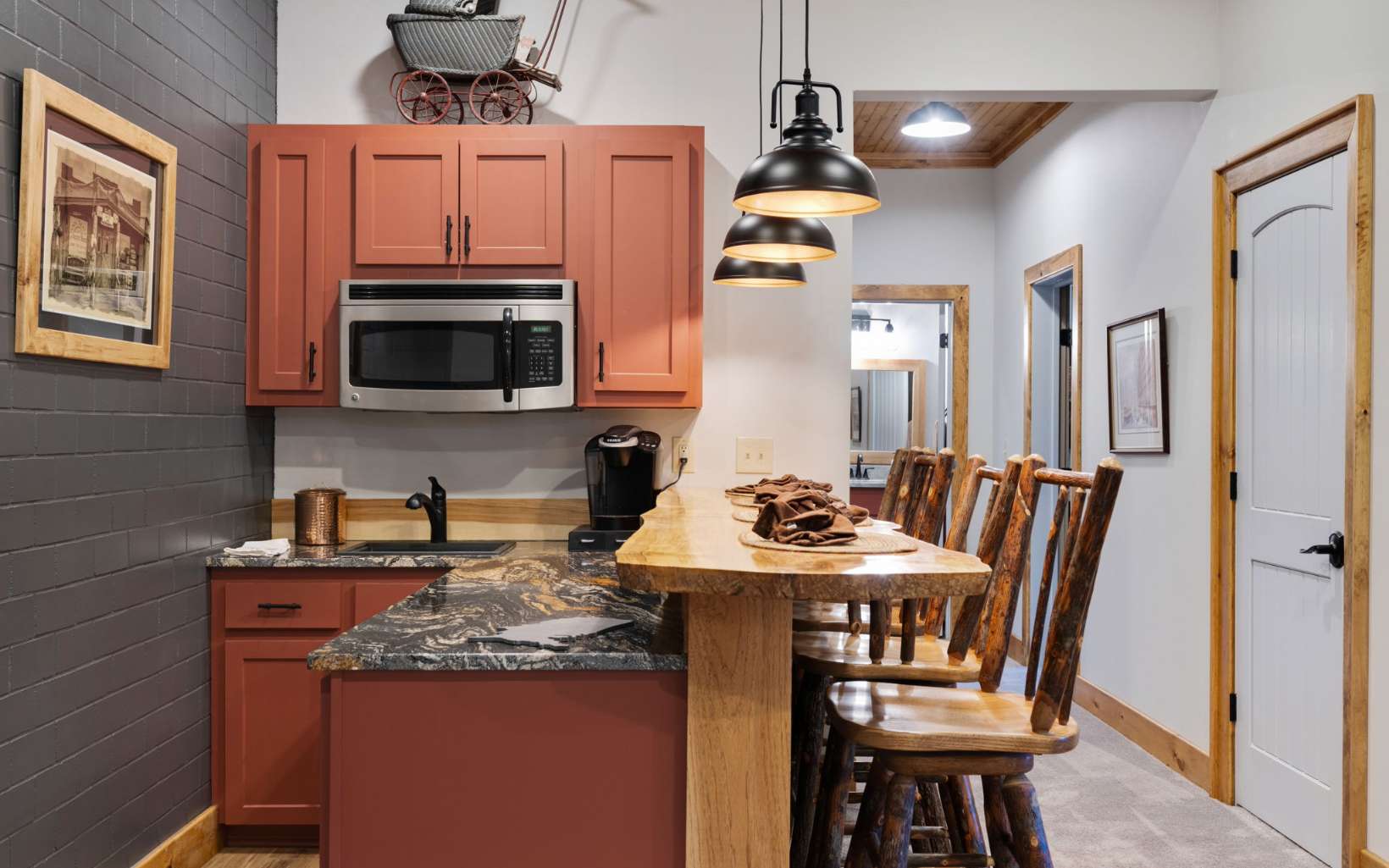 42 Overlook Road Blue Ridge, GA 30513 - Photo 25 of 63 a kitchen with stainless steel appliances kitchen island granite countertop a sink a microwave refrigerator and chairs