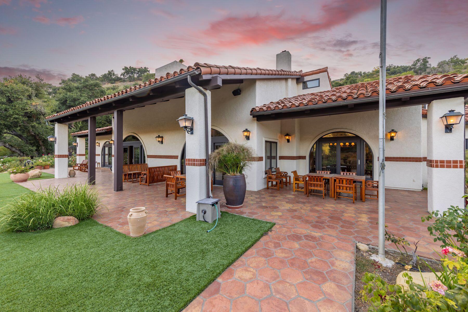 10883 Oak Knoll Road Ojai, CA 93023 - Photo 11 of 43 a view of a chair and table in backyard of the house