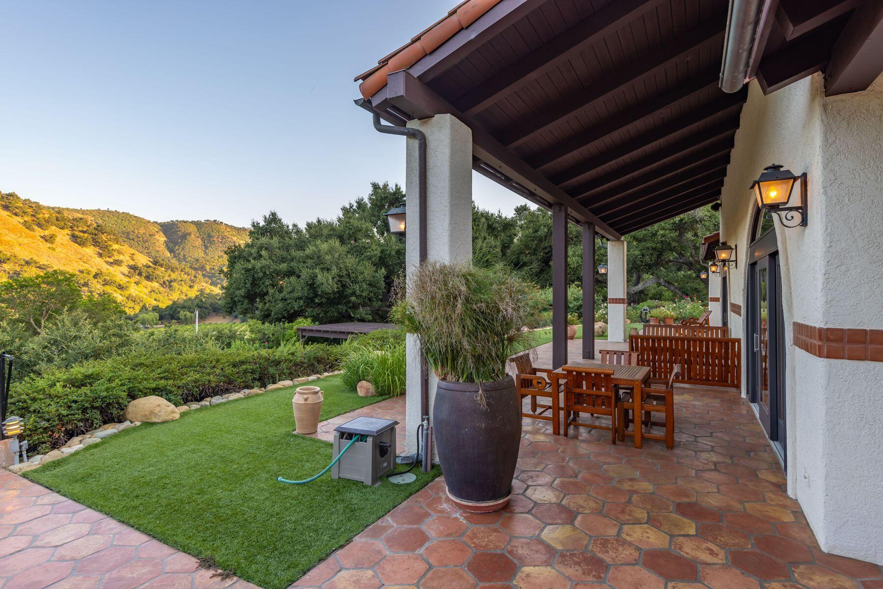 10883 Oak Knoll Road Ojai, CA 93023 - Photo 15 of 43 a view of a patio with chairs and backyard