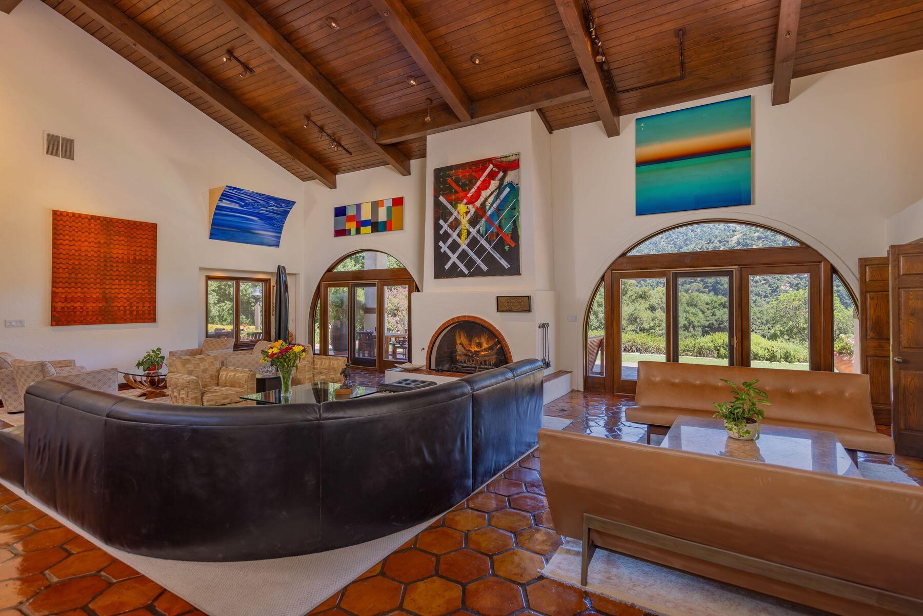 10883 Oak Knoll Road Ojai, CA 93023 - Photo 33 of 43 a living room with furniture and a fireplace