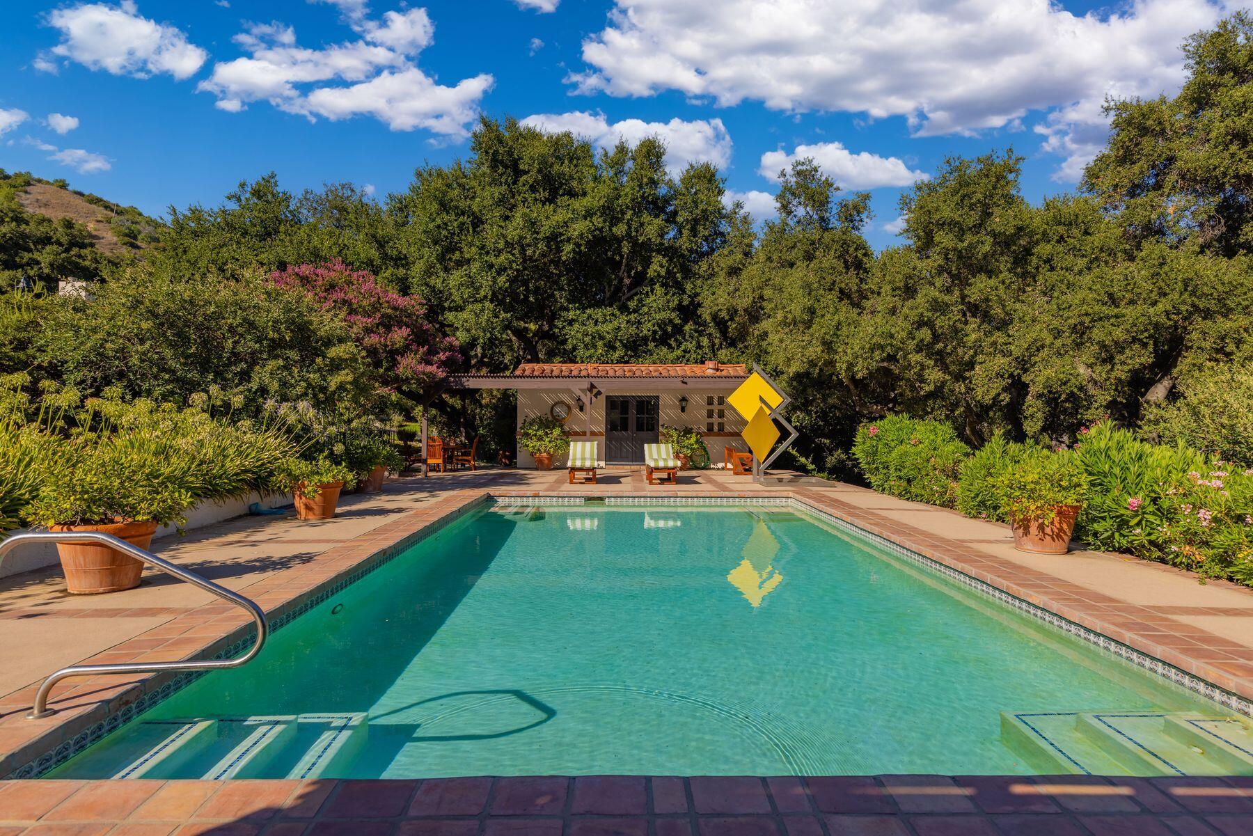 10883 Oak Knoll Road Ojai, CA 93023 - Photo 4 of 43 a view of a swimming pool with a garden