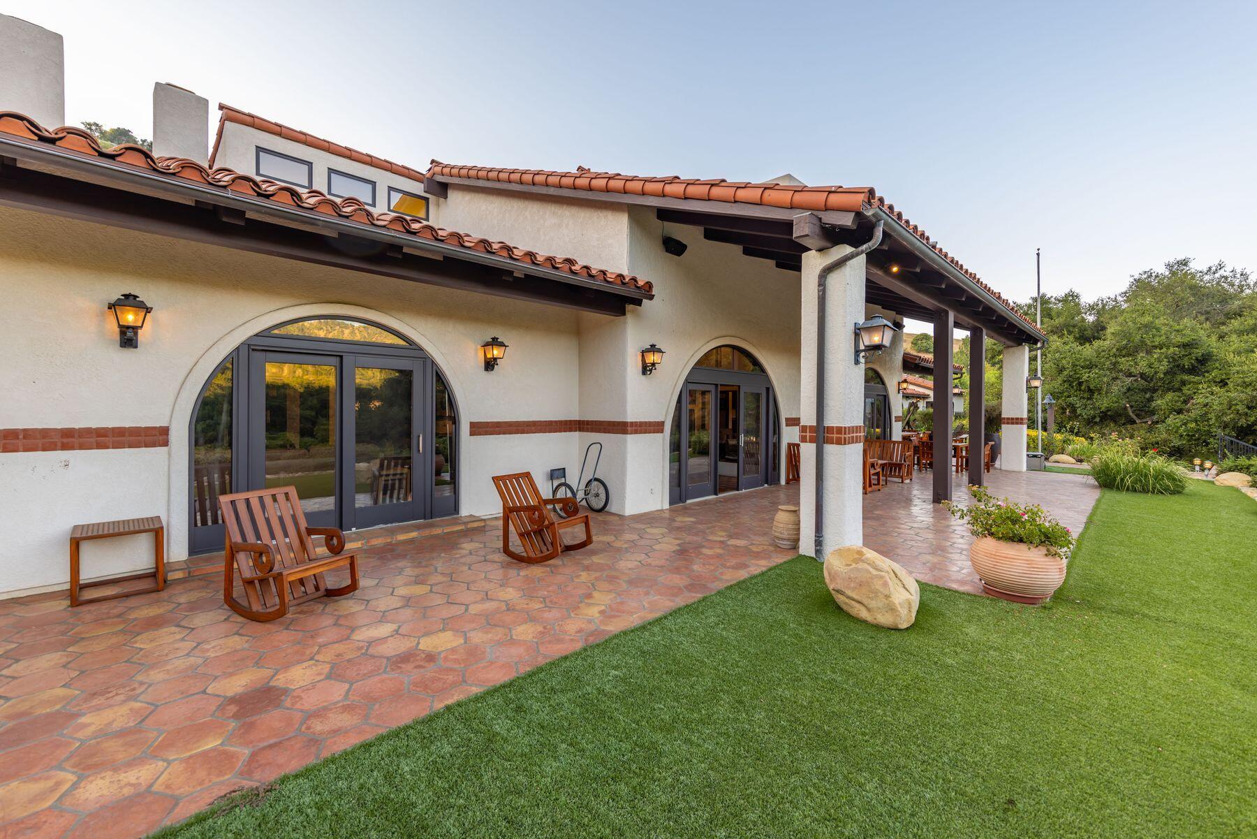10883 Oak Knoll Road Ojai, CA 93023 - Photo 5 of 43 a view of a chair and tables in the patio