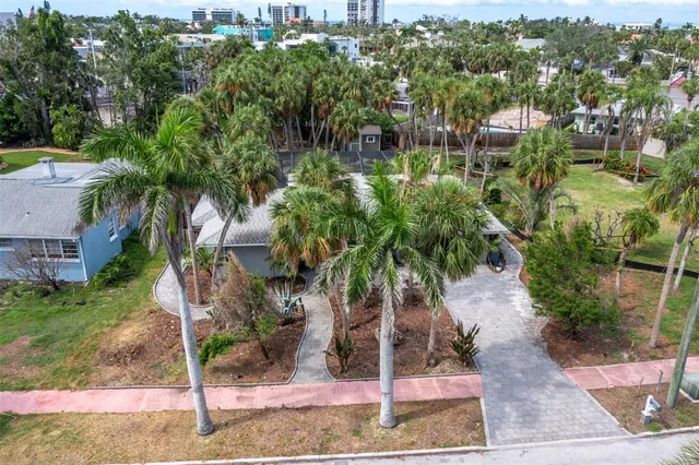 an aerial view of residential building and lake