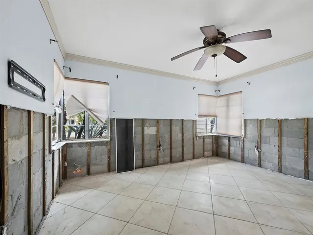 a view of a patio with a table and chairs