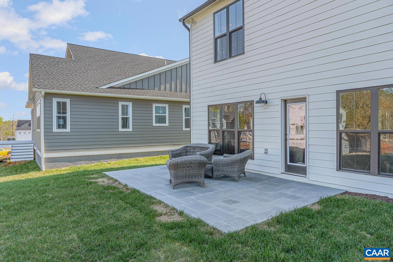 1731 Fowler Street Charlottesville, VA 22901 - Photo 7 of 45 a house that has a table and chairs in patio