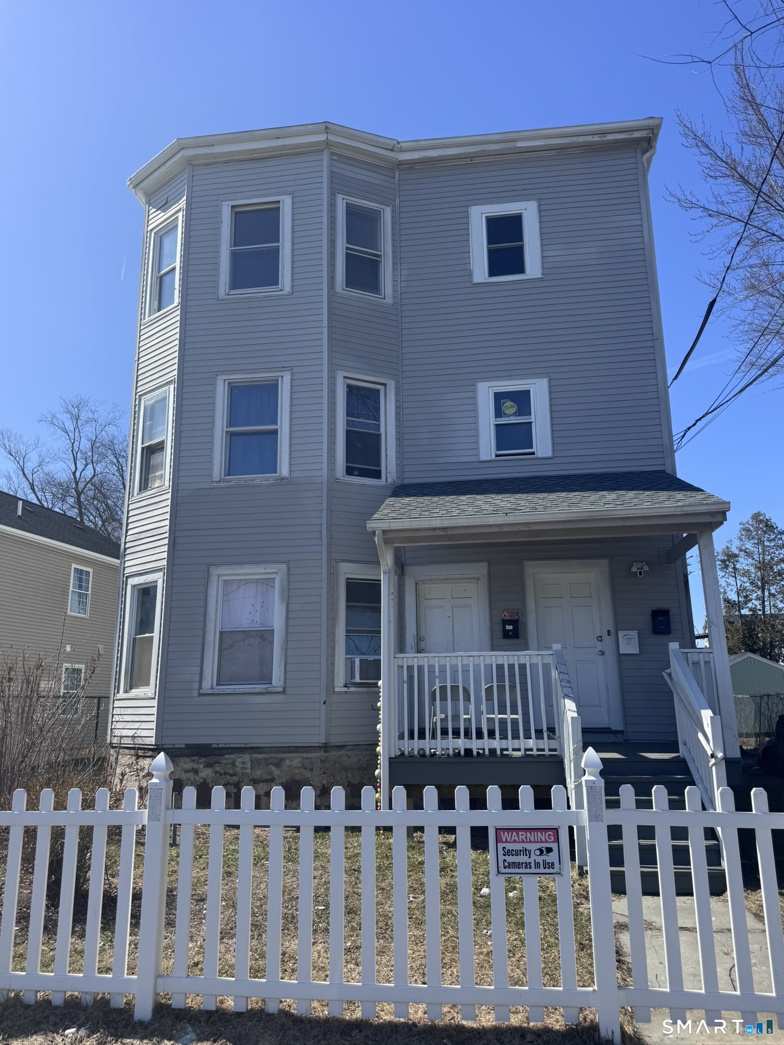 a front view of a house with glass windows