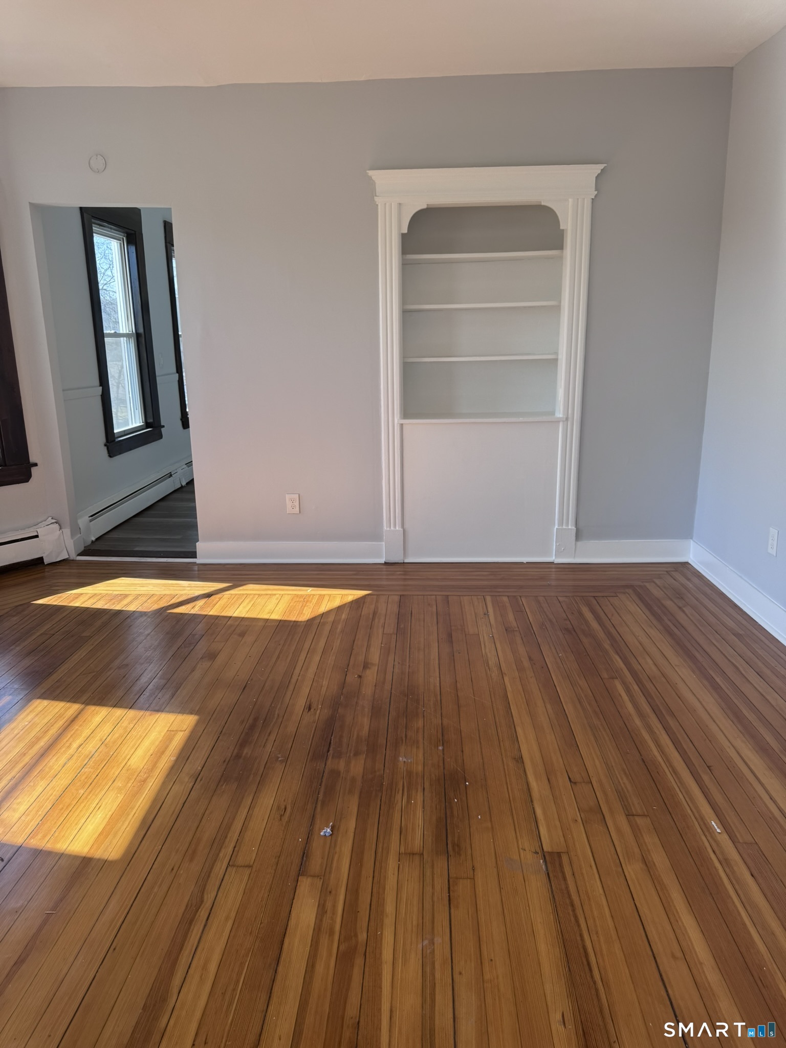 283 Martin Street Hartford, CT 06120 - Photo 5 of 16 a view of room with wooden floor and cabinet