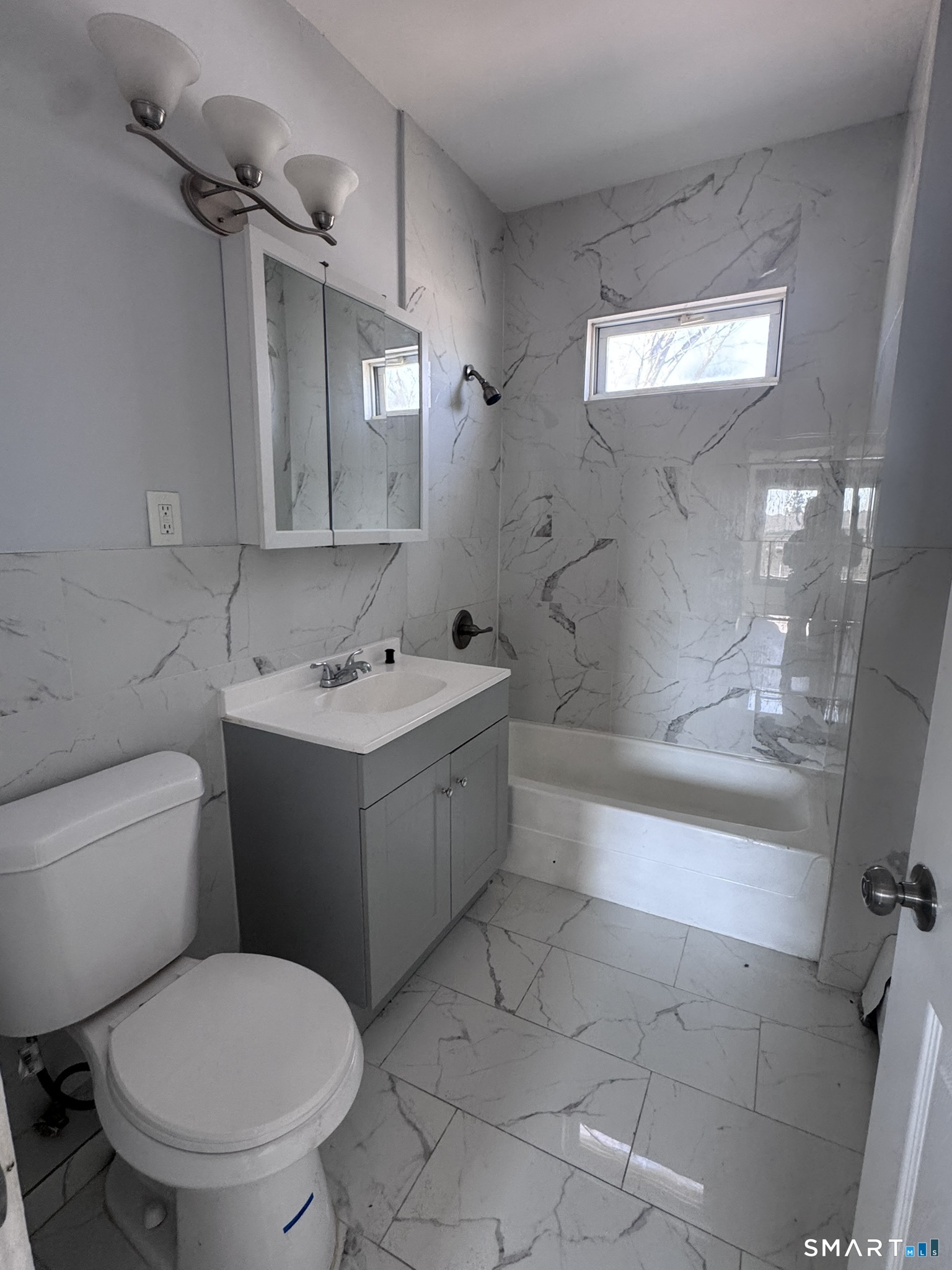 283 Martin Street Hartford, CT 06120 - Photo 10 of 16 a bathroom with a sink toilet and shower