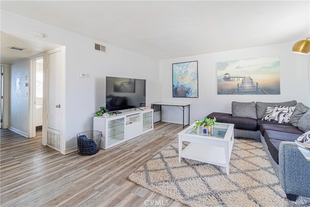 874 Cinnamon Lane, Unit 62 Duarte, CA 91010 - Photo 15 of 22 a living room with furniture and a flat screen tv