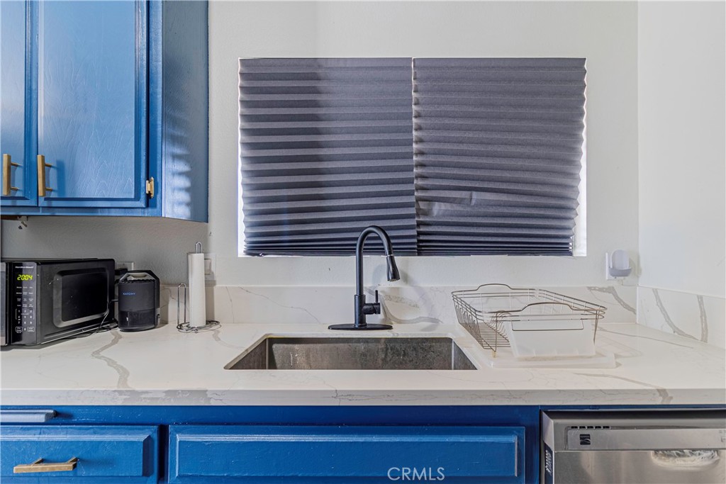 874 Cinnamon Lane, Unit 62 Duarte, CA 91010 - Photo 22 of 22 a kitchen with a sink and cabinets