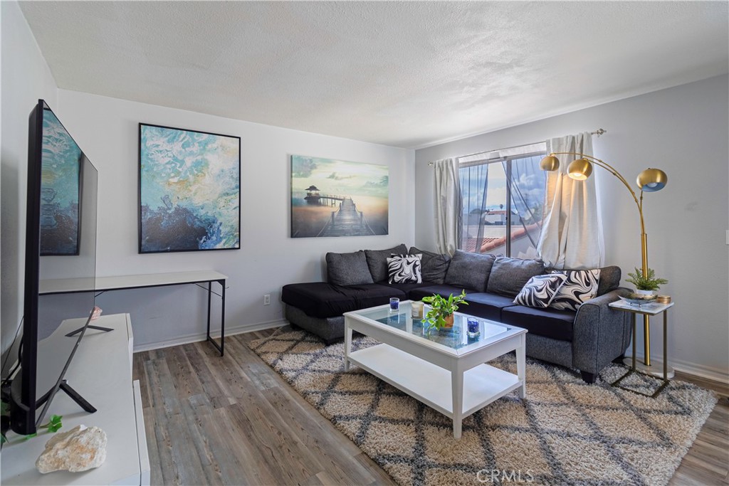 874 Cinnamon Lane, Unit 62 Duarte, CA 91010 - Photo 3 of 22 a living room with furniture and wooden floor