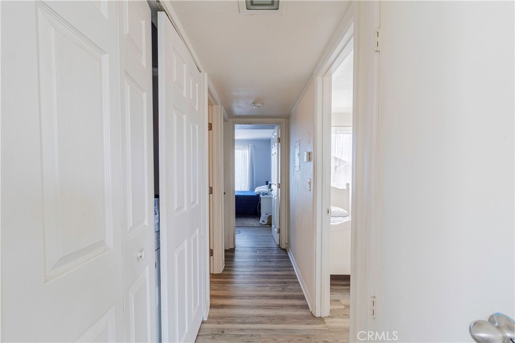 874 Cinnamon Lane, Unit 62 Duarte, CA 91010 - Photo 4 of 22 a view of a hallway with wooden floor and staircase