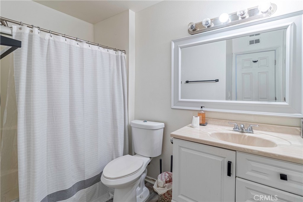 874 Cinnamon Lane, Unit 62 Duarte, CA 91010 - Photo 6 of 22 a bathroom with a sink toilet and mirror