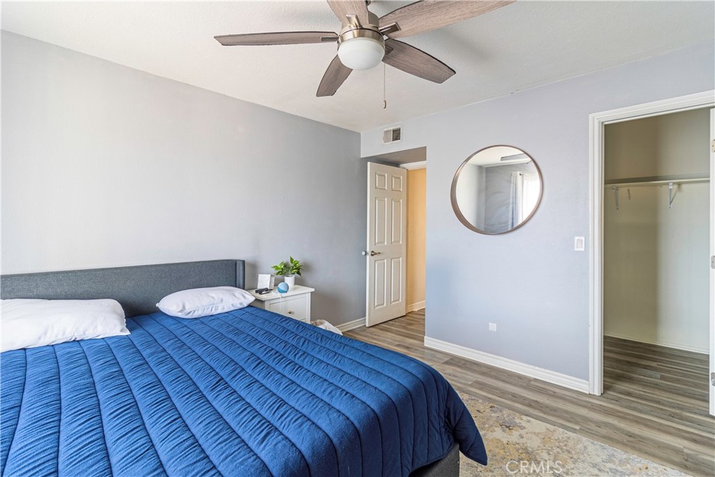 874 Cinnamon Lane, Unit 62 Duarte, CA 91010 - Photo 8 of 22 a bedroom with a bed and a chandelier