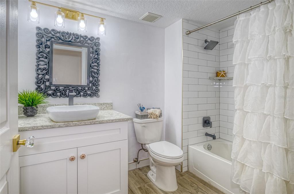 16600 Gulf Boulevard, Unit 536 North Redington Beach, FL 33708 - Photo 28 of 46 a bathroom with a sink a toilet and shower