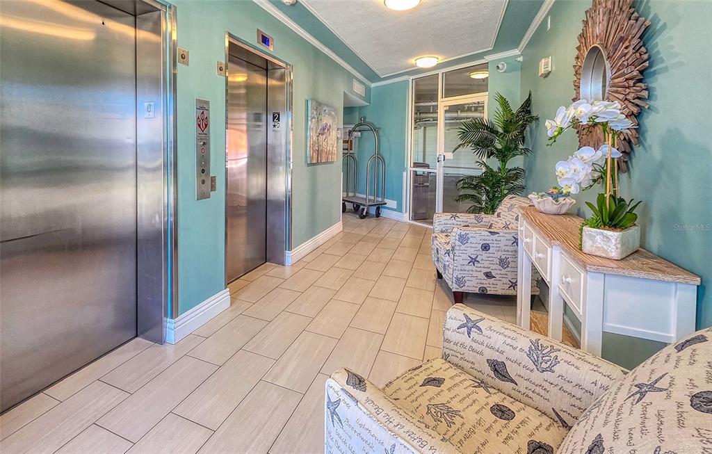 16600 Gulf Boulevard, Unit 536 North Redington Beach, FL 33708 - Photo 29 of 46 a bedroom with a bed and a mirror