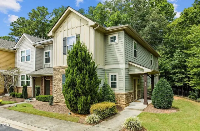 a view of a kitchen with a sink and wooden floor