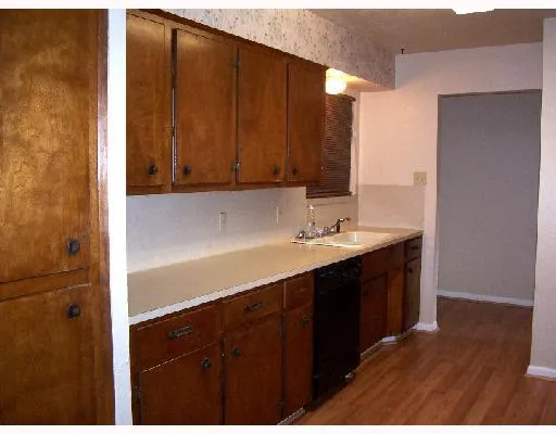 a kitchen with a sink and cabinets