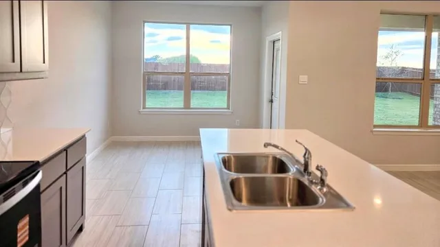 a view of a backyard with pathway