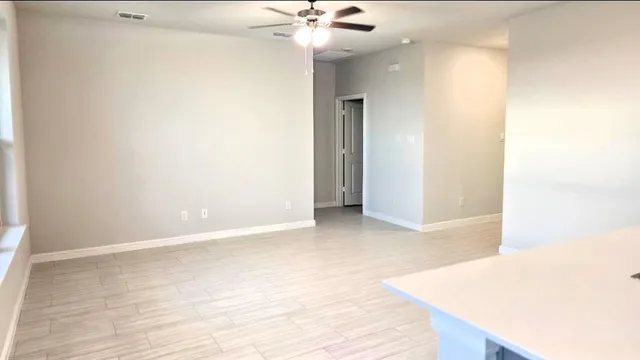 a kitchen with a refrigerator and a stove