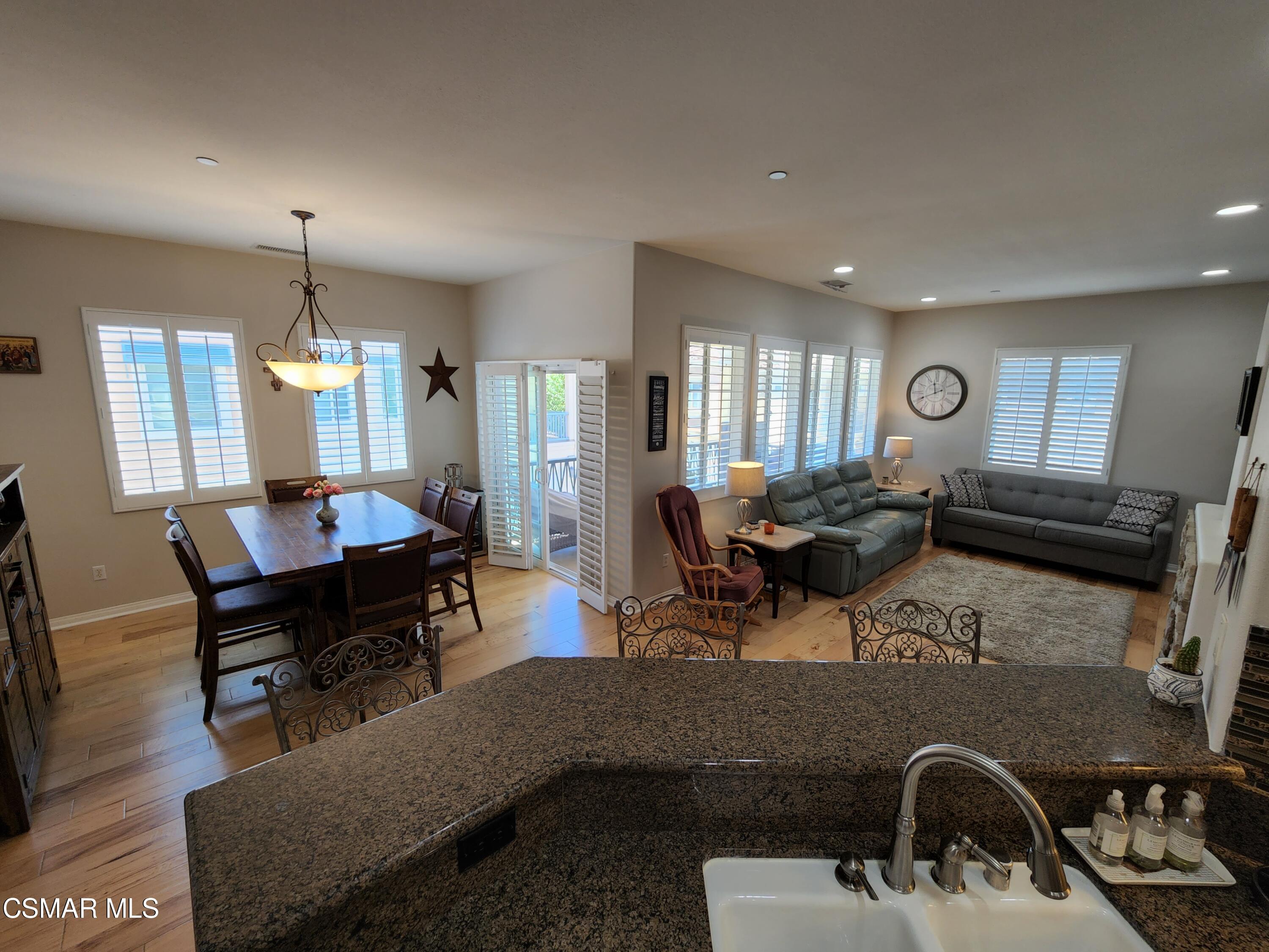 4121 Paredo Way, Unit D Simi Valley, CA 93063 - Photo 13 of 35 a living room with furniture a window and a mirror