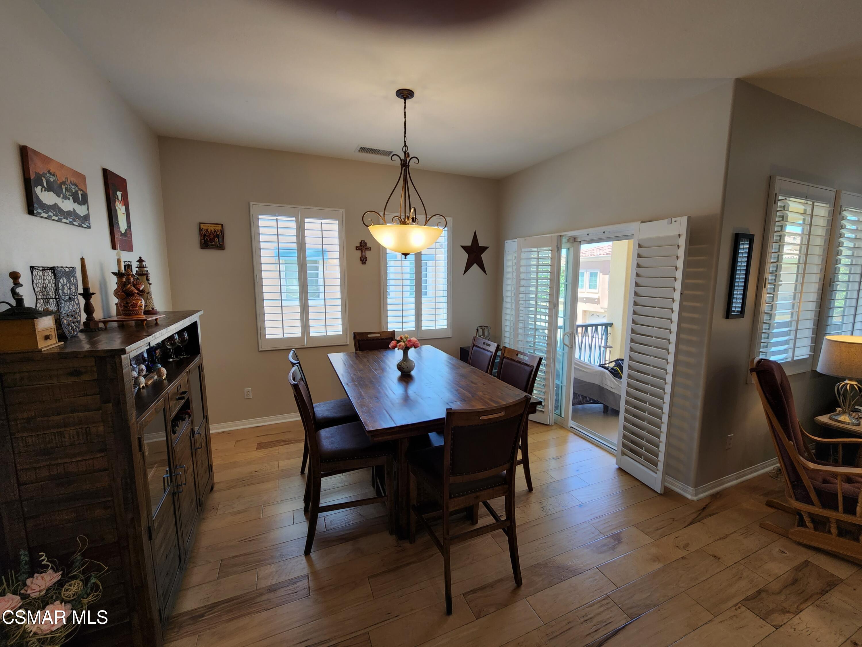 4121 Paredo Way, Unit D Simi Valley, CA 93063 - Photo 14 of 35 a view of a a dining room with furniture window and wooden floor