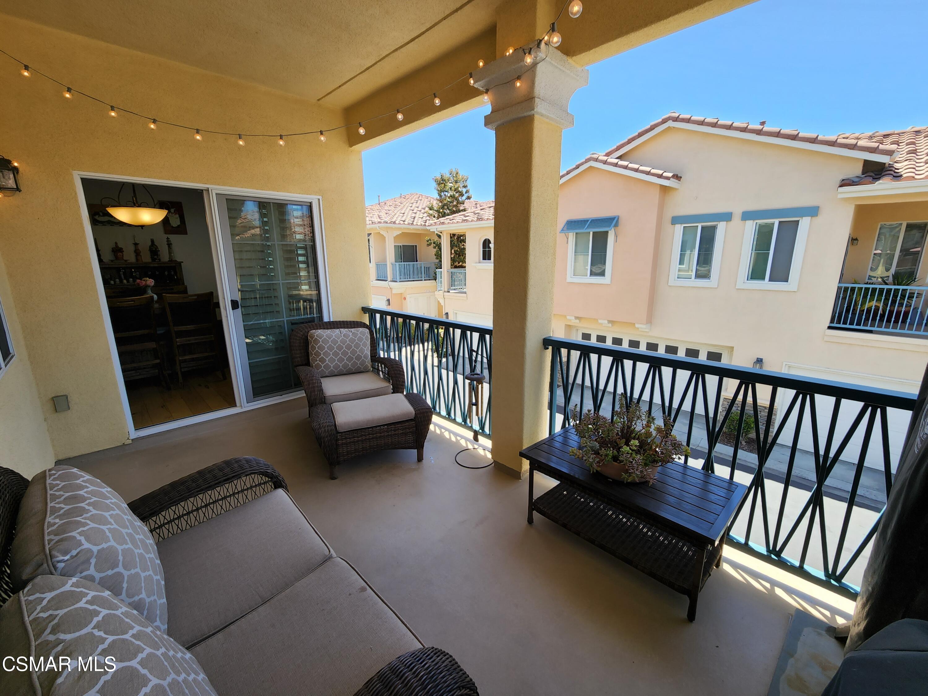 4121 Paredo Way, Unit D Simi Valley, CA 93063 - Photo 17 of 35 a balcony with furniture and a potted plant