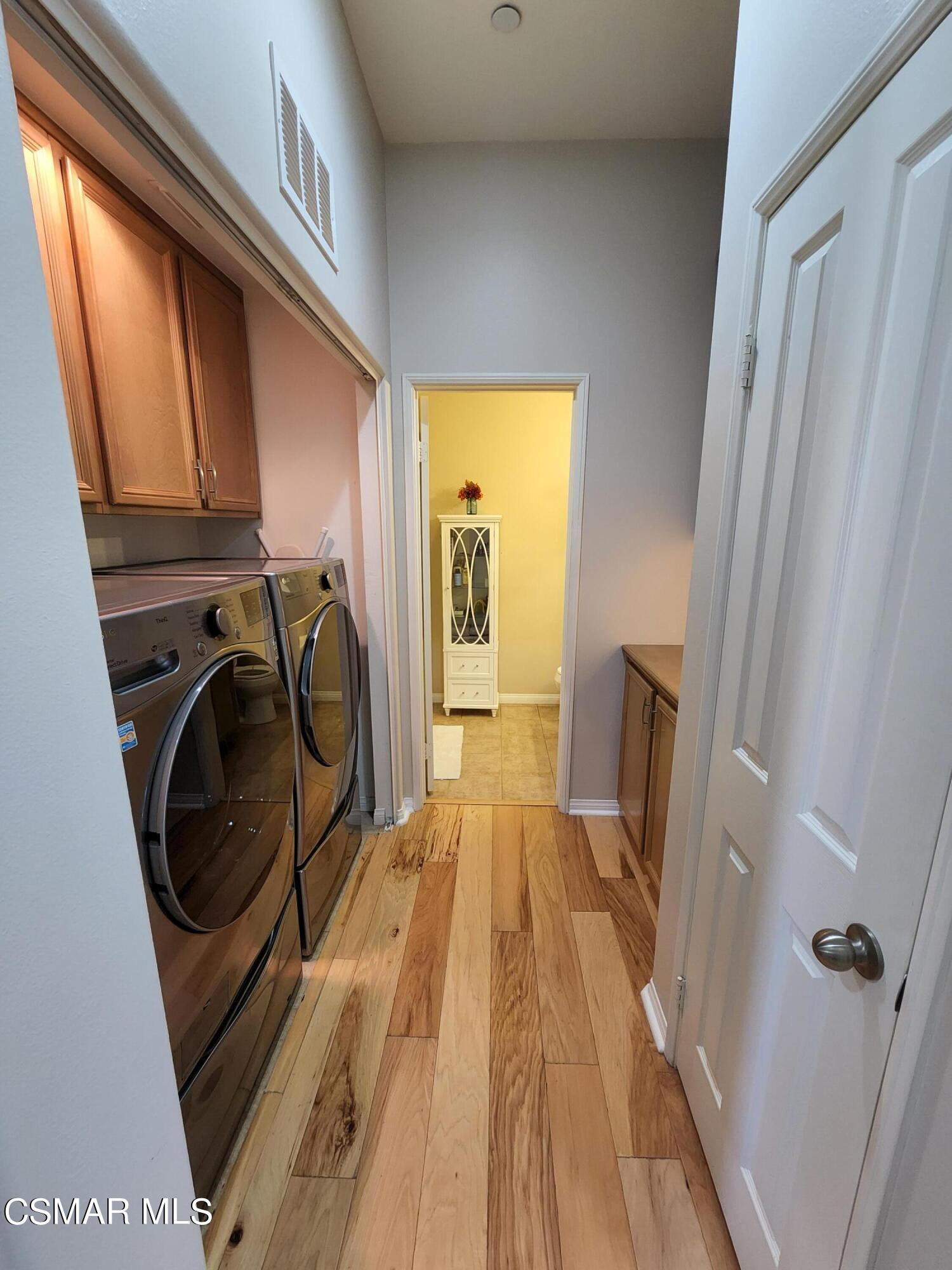 4121 Paredo Way, Unit D Simi Valley, CA 93063 - Photo 18 of 35 a view of a storage and utility room with washer and dryer
