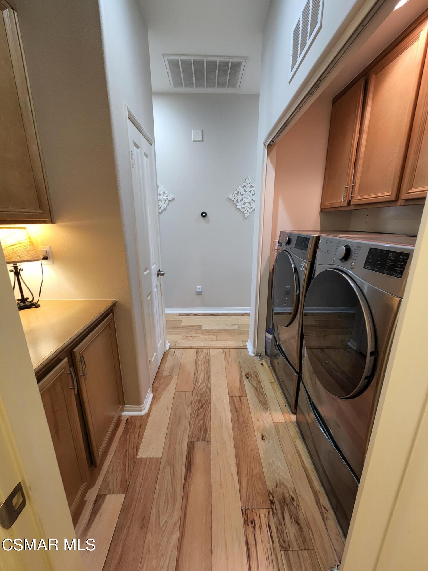 4121 Paredo Way, Unit D Simi Valley, CA 93063 - Photo 19 of 35 a view of utility room with washer and dryer