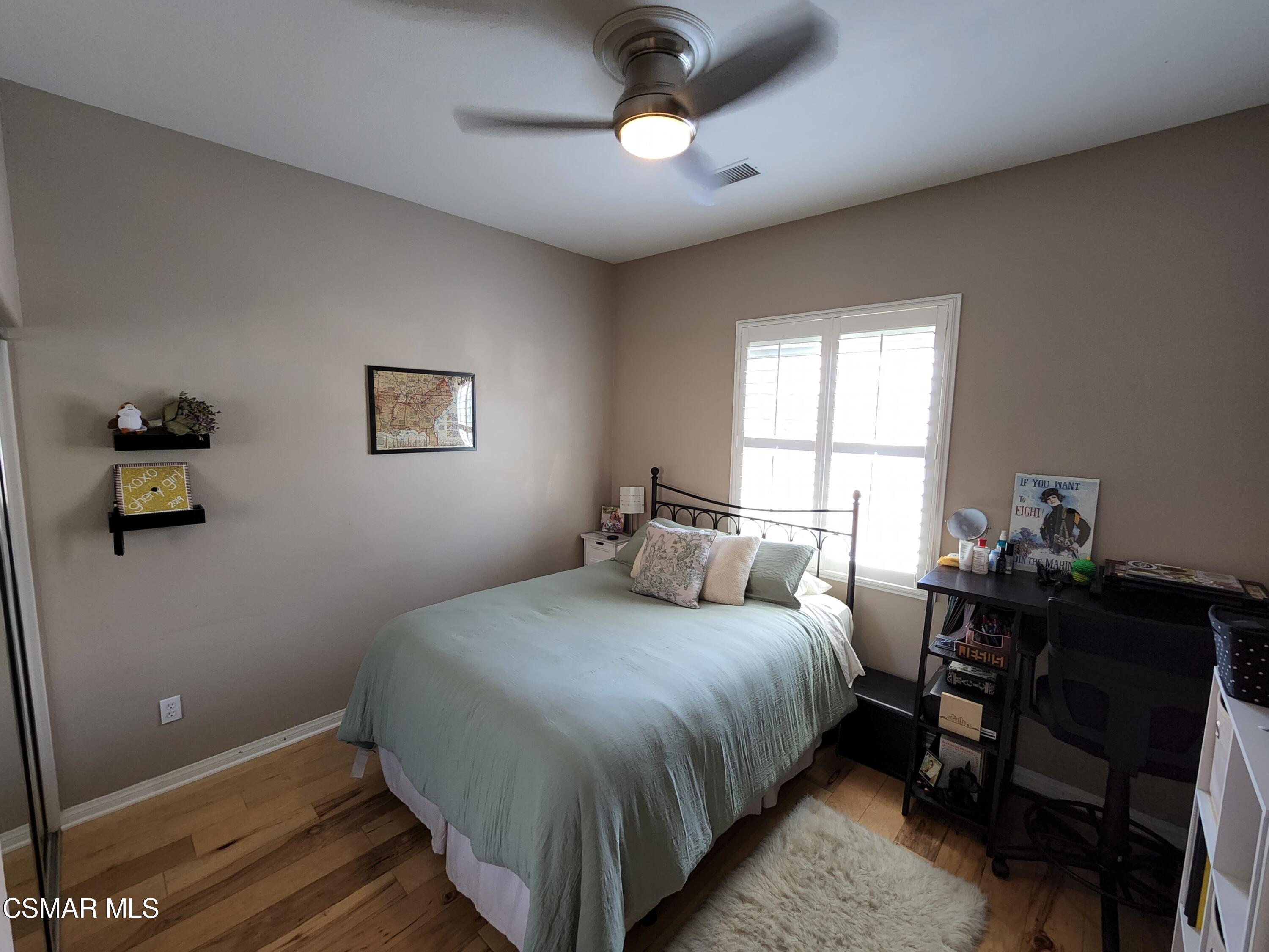 4121 Paredo Way, Unit D Simi Valley, CA 93063 - Photo 23 of 35 a bedroom with a bed and a window