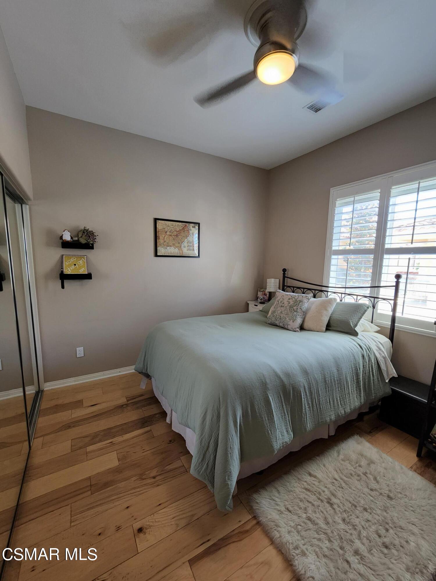 4121 Paredo Way, Unit D Simi Valley, CA 93063 - Photo 24 of 35 a bedroom with a bed and window