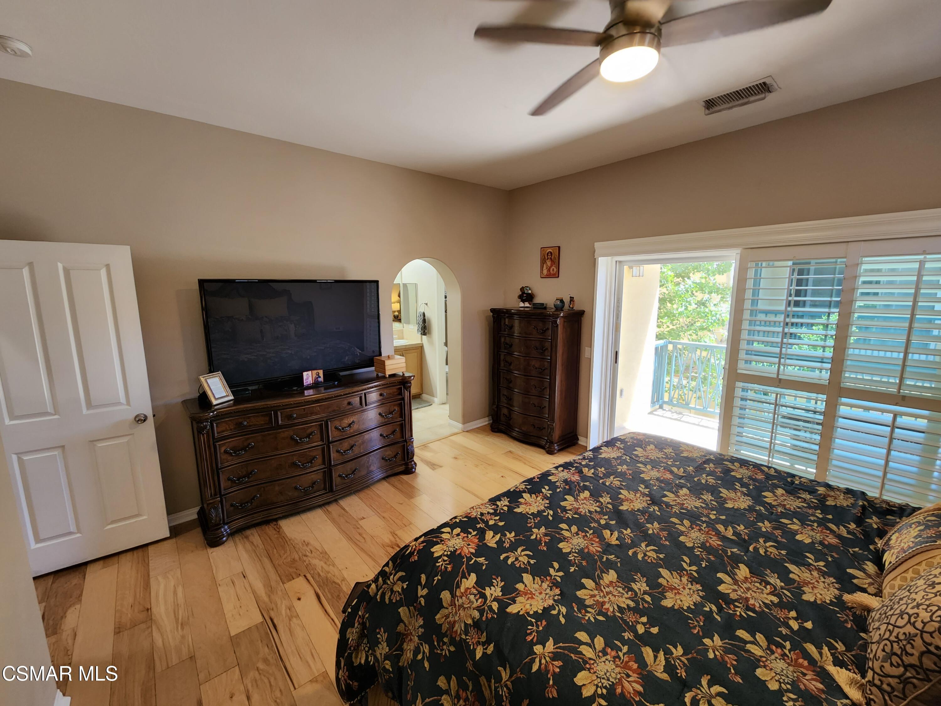 4121 Paredo Way, Unit D Simi Valley, CA 93063 - Photo 26 of 35 a bedroom with a bed and a television